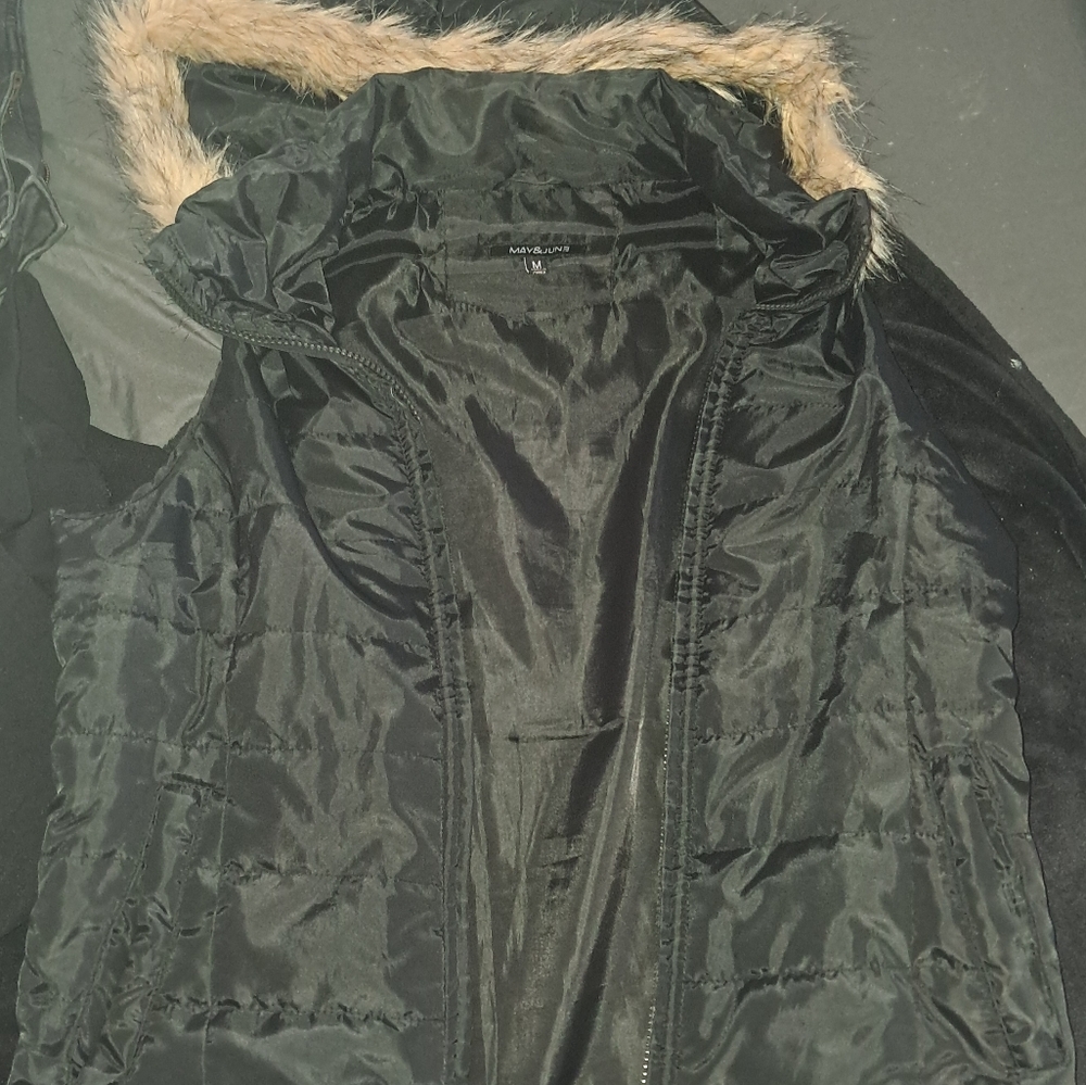 Puffer vest with fur trim hood